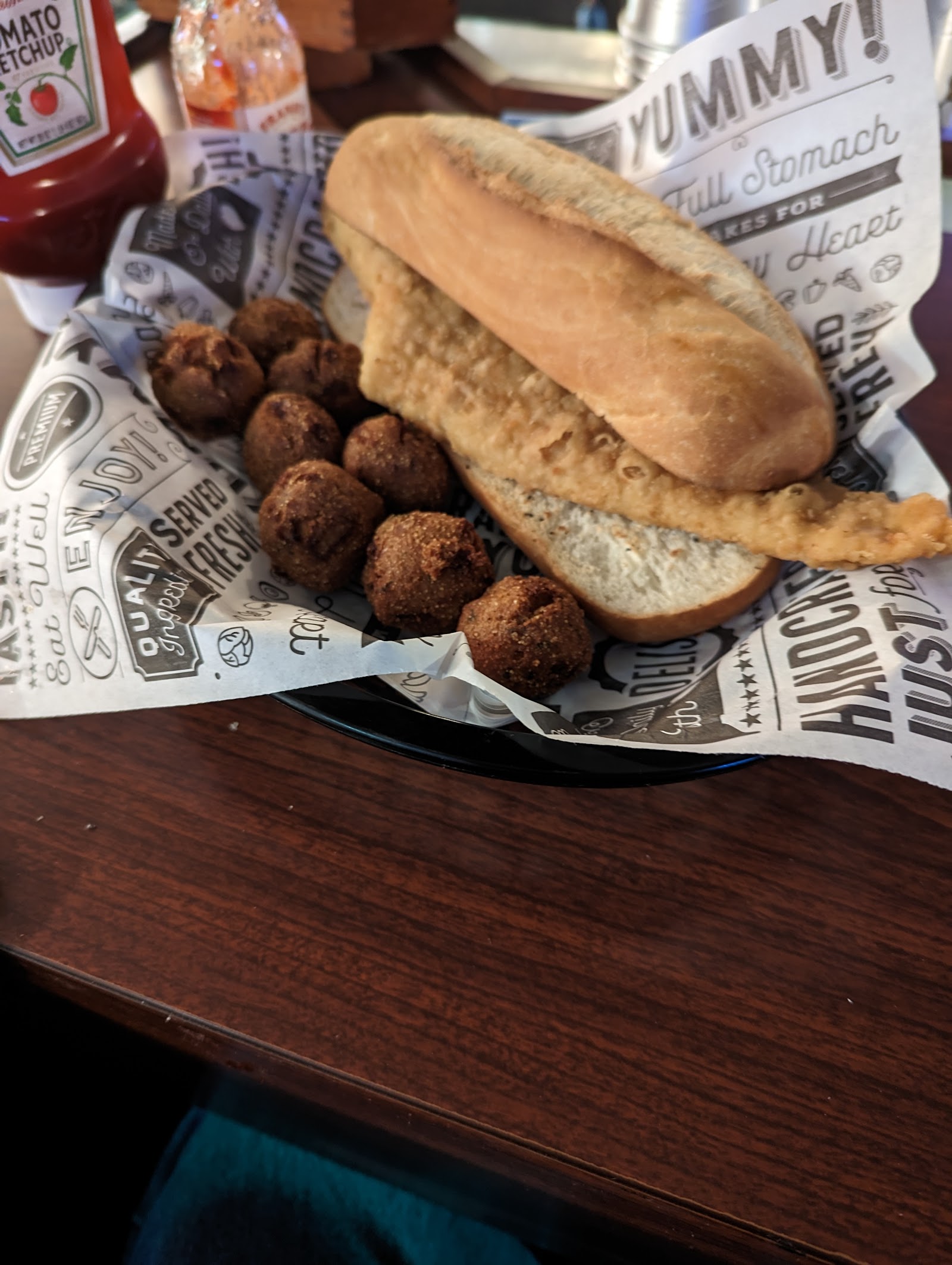 Hot sausage sandwich with hush puppies